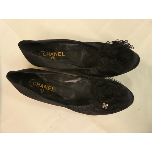 126 - Two pairs of black pumps, viz. Chanel with lace bows  size 40; and Prada, decorated with turquo... 