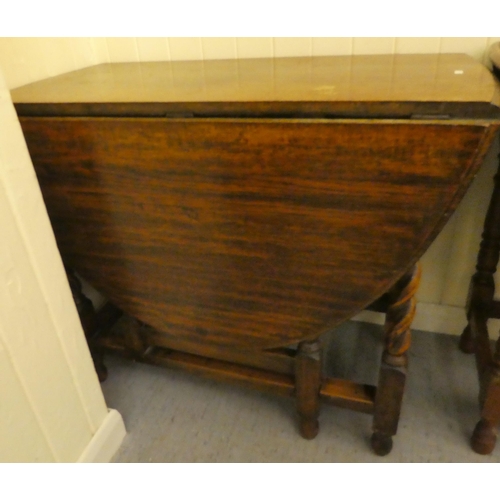 181 - Two 1930s oak drop leaf dining tables, raised on turned legs  30