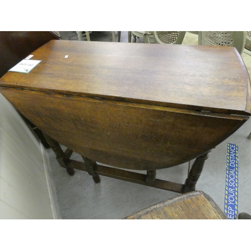 181 - Two 1930s oak drop leaf dining tables, raised on turned legs  30