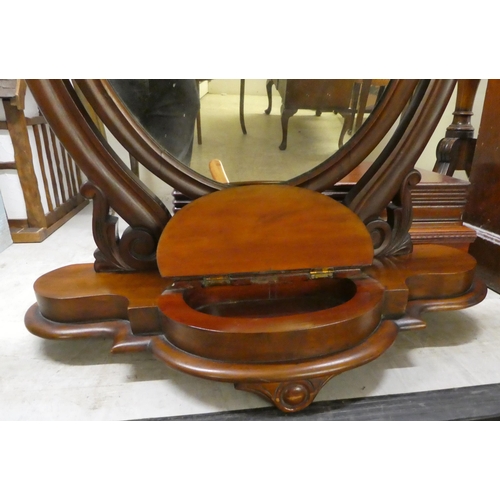172 - A late Victorian mahogany framed dressing mirror, on a stepped serpentine front plinth  30
