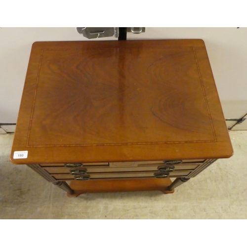 180 - A reproduction of an Edwardian crossbanded mahogany canteen chest (only), having a hinged lid and ar... 