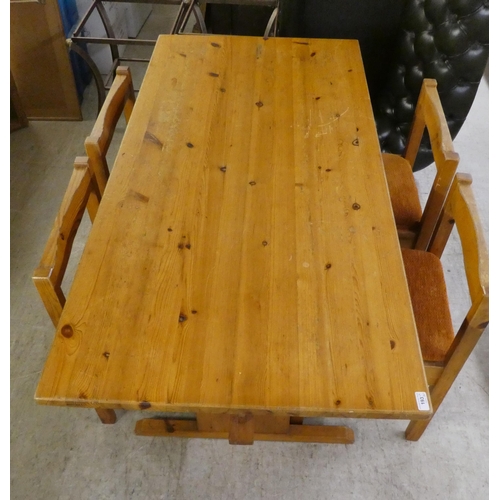 193 - A 20thC honey coloured waxed pine kitchen table, raised on planked supports and splayed feet  3... 