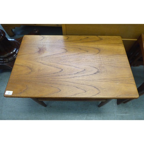 17 - 1980s teak furniture, viz. a nesting set of three tables  largest 19