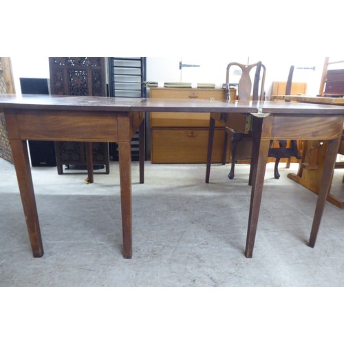 336 - A 19thC mahogany drop leaf dining table, raised on square, tapered legs  28