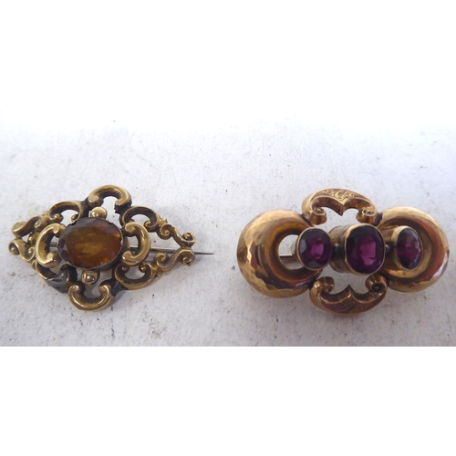 146 - Yellow metal items of personal ornament: to include a late Victorian, ruby coloured stone set brooch