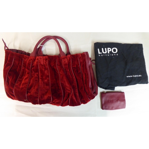 16 - Three oversize shoulder bags, viz. one in deep red velvet with a dust cover; one dark beige with hea... 