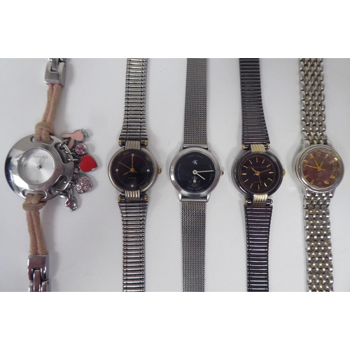 20 - Modern ladies and gentleman's wristwatches: to include a Radley, faced by an Arabic dial