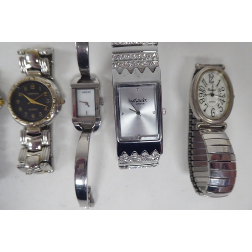 20 - Modern ladies and gentleman's wristwatches: to include a Radley, faced by an Arabic dial