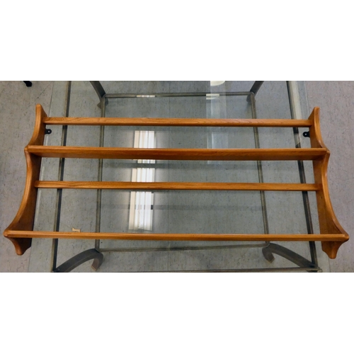 An Ercol two tier beech and elm hanging plate rack 19