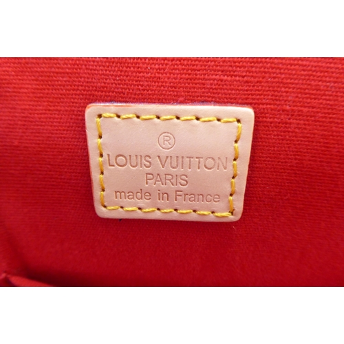 51 - A bright red patent, oversize handbag