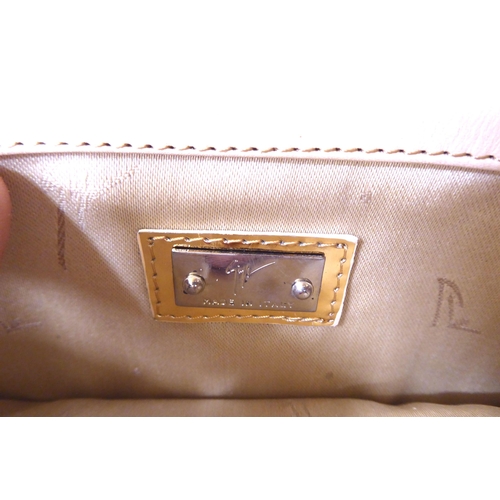 6 - Two shoulder bags, one beige and cream, one beige and ruby coloured with buckles; and a black satin ... 