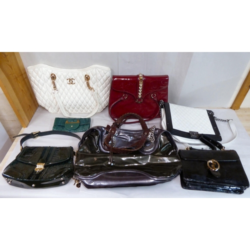 72 - Various handbags: to include a red patent example, ornamented with metal studs; a bottle green paten... 