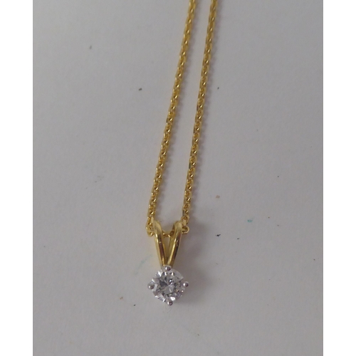 76 - An 18ct gold pendant necklace, set with a round cut diamond