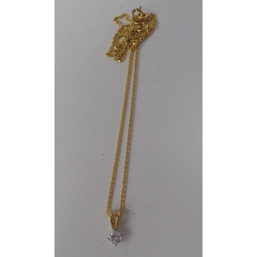 76 - An 18ct gold pendant necklace, set with a round cut diamond