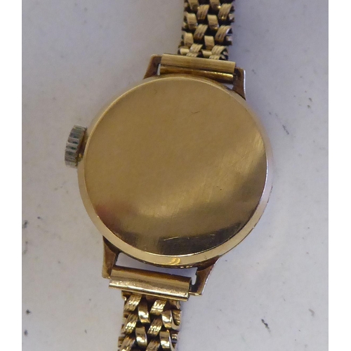 94 - A lady's 9ct gold cased Certina wristwatch, faced by an Arabic dial