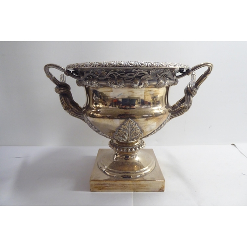 1 - Silver plate, viz. a twin handled pedestal wine cooler; and an epergne  20