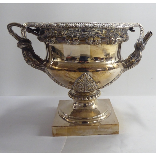 1 - Silver plate, viz. a twin handled pedestal wine cooler; and an epergne  20