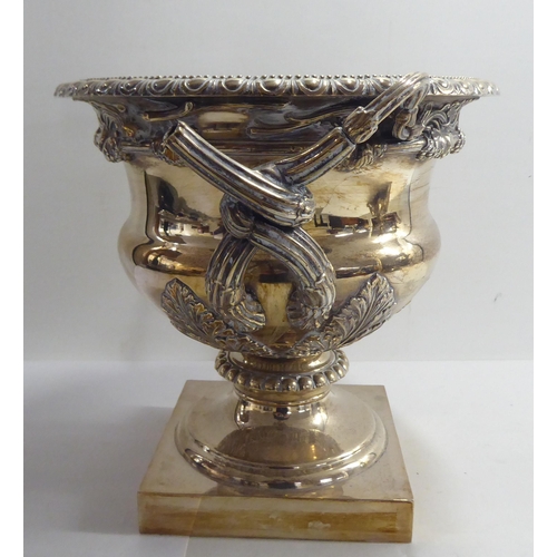 1 - Silver plate, viz. a twin handled pedestal wine cooler; and an epergne  20