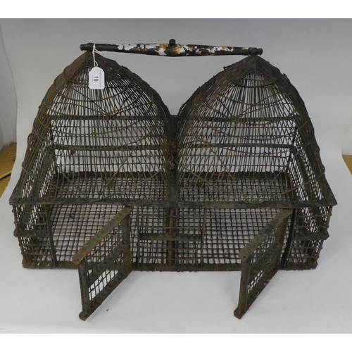 10 - A late 19thC conjoined pair of painted steel wire framed bird cages of double domed design, each wit... 