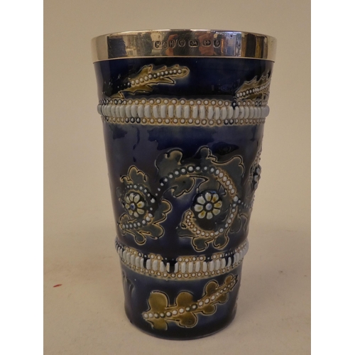 100 - A late Victorian Doulton Lambeth stoneware beaker, decorated with applied and moulded floral ornamen... 