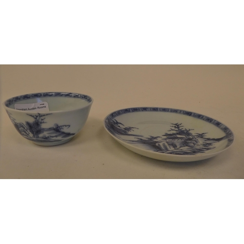 109 - A Nanking Cargo porcelain tea bowl and saucer, decorated in blue and white with buildings  bear... 