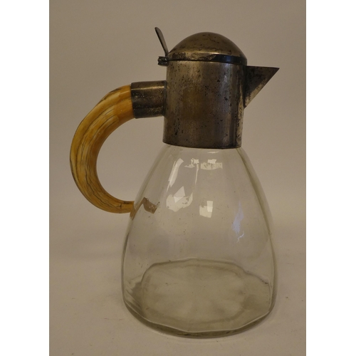 11 - A late 19thC Arts & Crafts glass cordial jug of multi-panelled, bell design with an applied whit... 