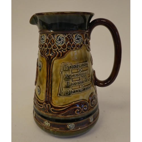 110 - A Doulton Lambeth two tone brown and green stoneware jug of tapered form, celebrating the life of Qu... 