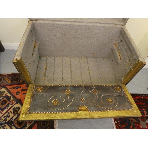 112 - An antique Continental, domed top trunk with decoratively stud finished and hide covered ornament wi... 