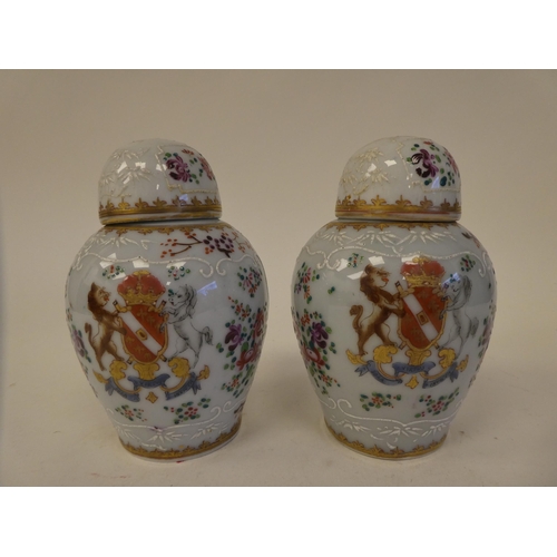 114 - A pair of Samson inspired porcelain covered tea caddies of baluster form, decorated in colours and g... 