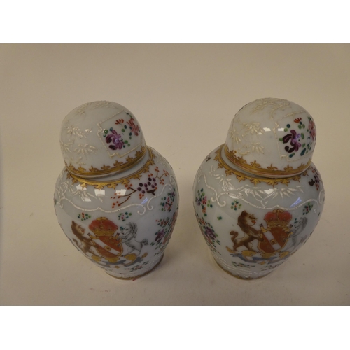 114 - A pair of Samson inspired porcelain covered tea caddies of baluster form, decorated in colours and g... 