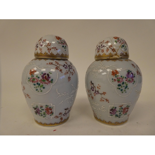 114 - A pair of Samson inspired porcelain covered tea caddies of baluster form, decorated in colours and g... 