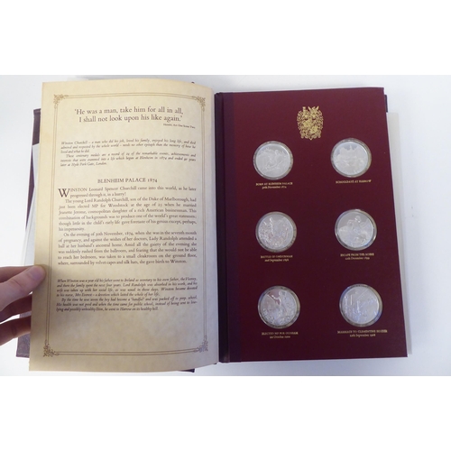 116 - An album collection of twenty-four, Limited Edition, Sterling silver medallions, issued by John Pinc... 