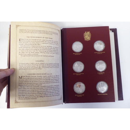 116 - An album collection of twenty-four, Limited Edition, Sterling silver medallions, issued by John Pinc... 