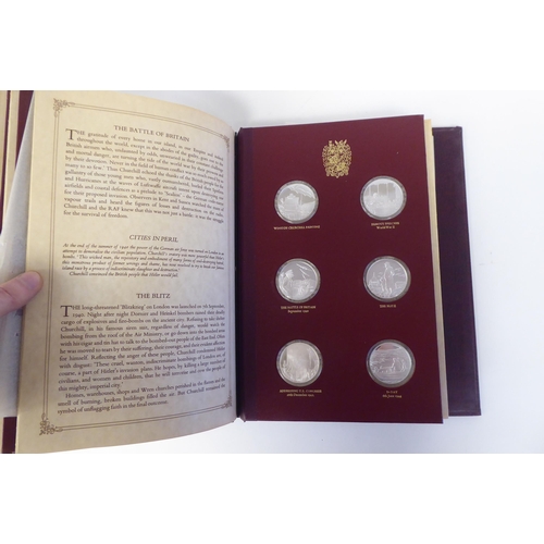 116 - An album collection of twenty-four, Limited Edition, Sterling silver medallions, issued by John Pinc... 