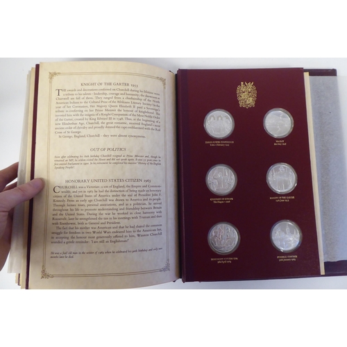 116 - An album collection of twenty-four, Limited Edition, Sterling silver medallions, issued by John Pinc... 