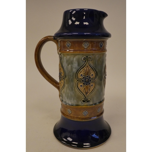 118 - A Royal Doulton blue, green and brown glazed stoneware water jug of cylindrical form, on a splayed b... 