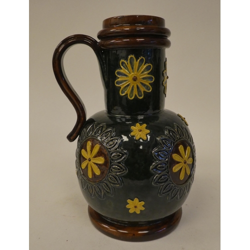 120 - A Doulton Lambeth brown, green and sand coloured stoneware flask of bulbous form with a narrow, stra... 