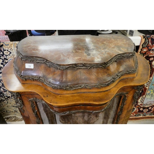 13 - A 19thC kingwood veneered, serpentine front vitrine with scrolled metal mounts, the platform cornice... 