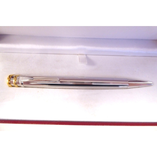 15 - A Cartier bi-coloured stainless steel ballpoint pen  boxed