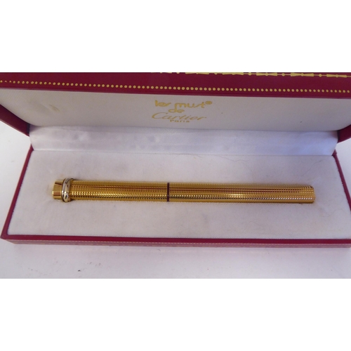 16 - A Cartier gilded and textured, oval shape fountain pen 76995  1*197*  boxed