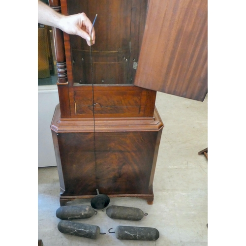 18 - An early 19thC mahogany longcase clock, the hood with a swan neck pediment, over an arched window an... 