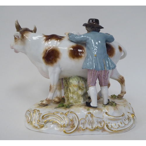 21 - A Meissen porcelain group, featuring a cow, a milkmaid and her suitor  inscribed R78, on an ova... 