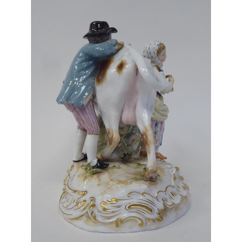 21 - A Meissen porcelain group, featuring a cow, a milkmaid and her suitor  inscribed R78, on an ova... 