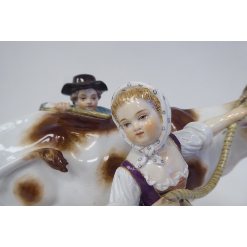 21 - A Meissen porcelain group, featuring a cow, a milkmaid and her suitor  inscribed R78, on an ova... 