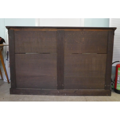 3 - A 19thC Continental rosewood and floral marquetry breakfront cabinet, comprising three inline, full ... 