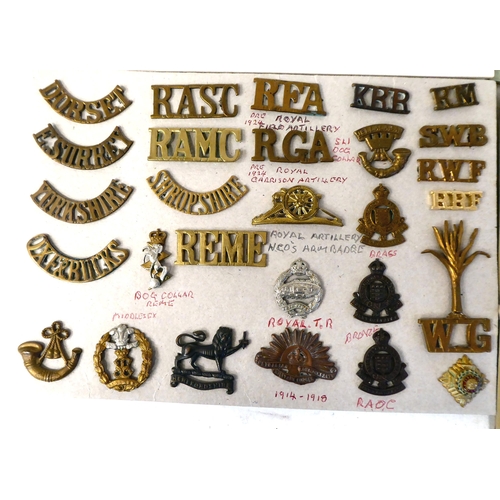 306 - Over fifty British military cap badges and other insignia, some copies: to include Royal Artillery; ... 