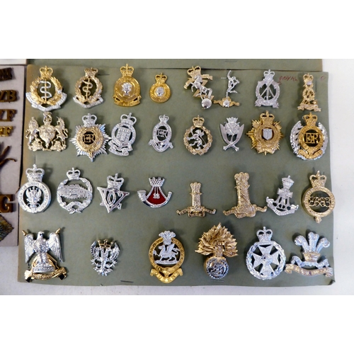 306 - Over fifty British military cap badges and other insignia, some copies: to include Royal Artillery; ... 