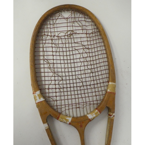 31 - A 1930s Hazells Streamline Red Star tennis racquet, bears various marks, including that of Joshua Ta... 