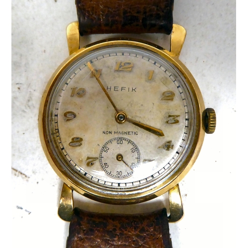 310 - A Hefik 9ct gold cased wristwatch, faced by an Arabic dial with subsidiary seconds, on a stitched br... 