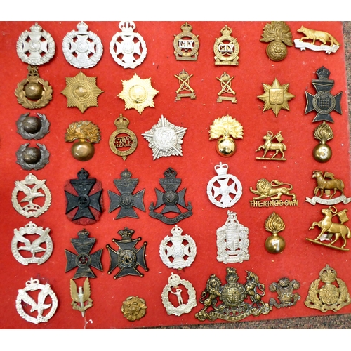 321 - Approx. sixty-four British military cap badges and other insignia, some copies: to include The 17th/... 